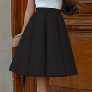 NWOT ❤️ RAOUL ❤️Black party skirt. Size: M